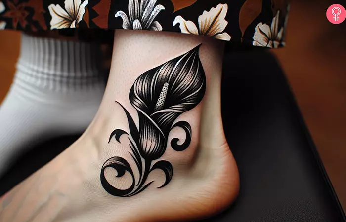 Black calla lily tattoo on ankle