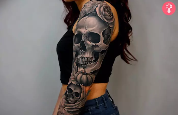 Black and gray Halloween sleeve tattoo on the upper arm