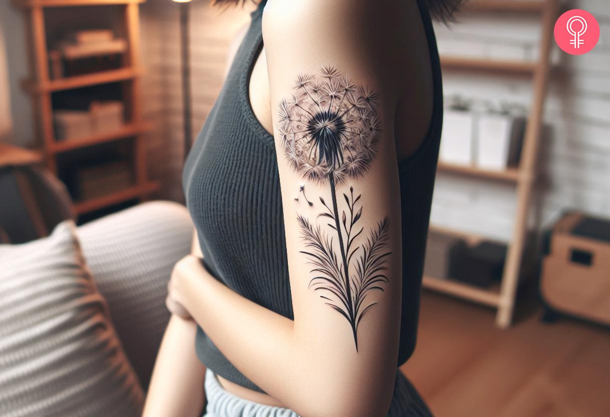 Black and white dandelion tattoo on upper arm