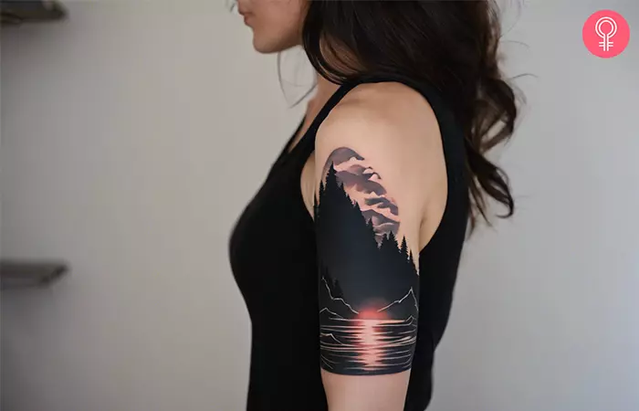 A blackout tattoo with color for a landscape piece