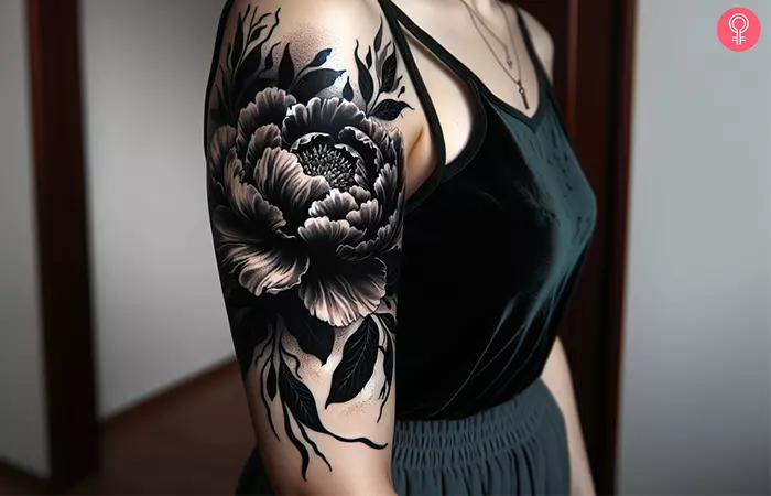 A floral blackout tattoo with white ink for highlights