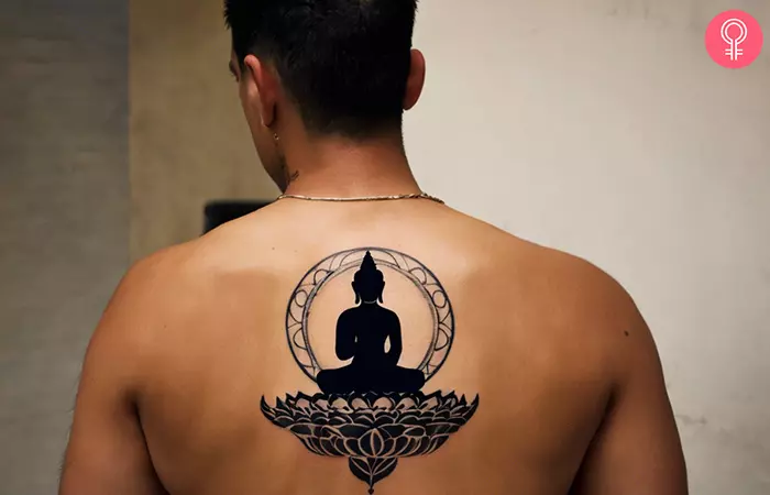 Buddha tattoo on the back of a man