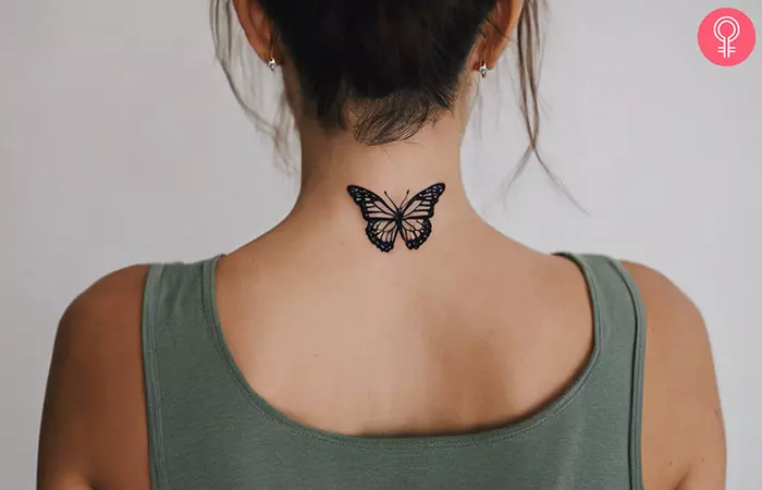 Butterfly tattoo on the back of a woman’s neck