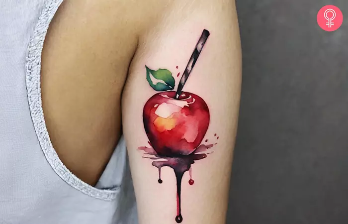 Candied apple tattoo on the arm