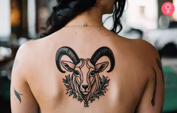 Woman with Capricorn goat tattoo on her back