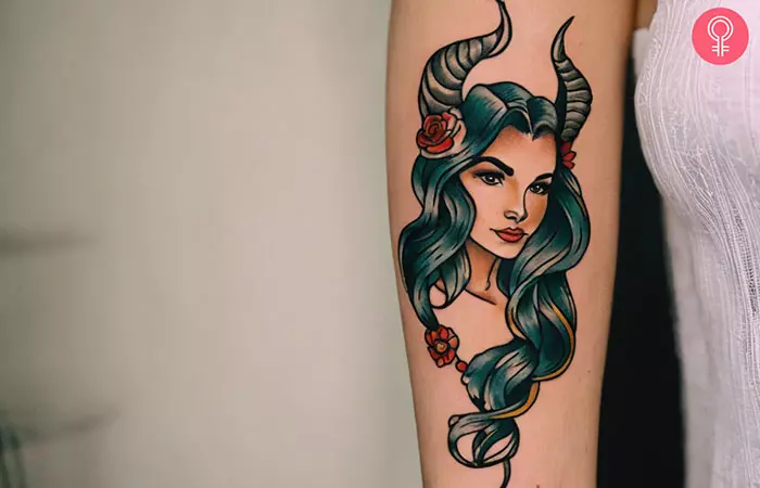 Woman with Capricorn tattoo on her forearm