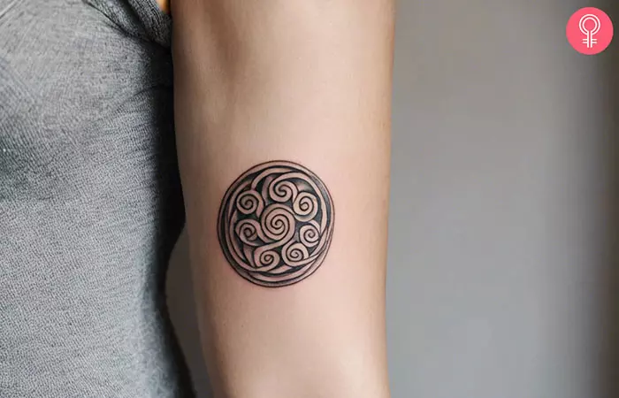 Celtic spiral tattoo on the forearm