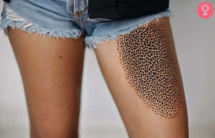 Cheetah print tattoo on a woman’s thigh