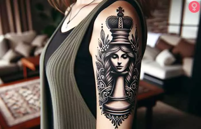 A woman queen chess piece tattoo on a woman’s arm
