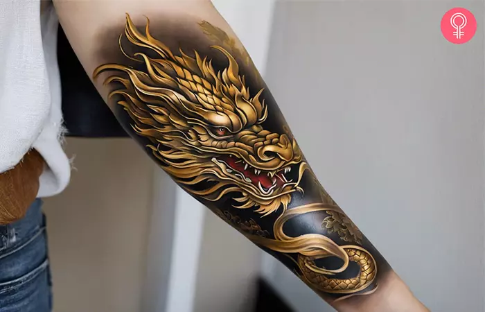 Chinese golden dragon tattoo on the forearm