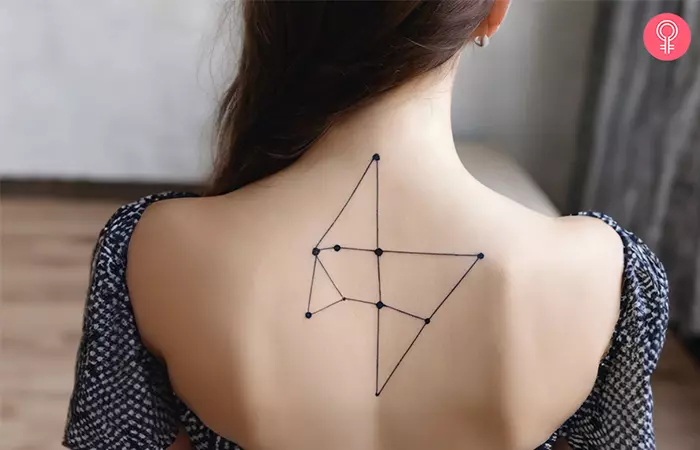 A woman with a constellation tattoo on her back