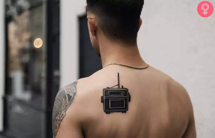 A man sporting a cool back tattoo