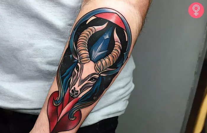 A man with a cool Capricorn tattoo on his forearm