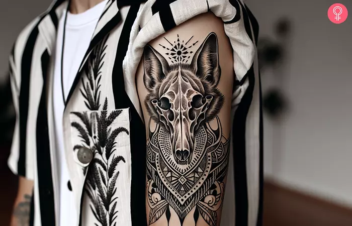 Coyote skull tattoo on a man’s arm