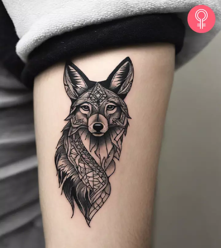 Coyote tattoo on a man’s arm