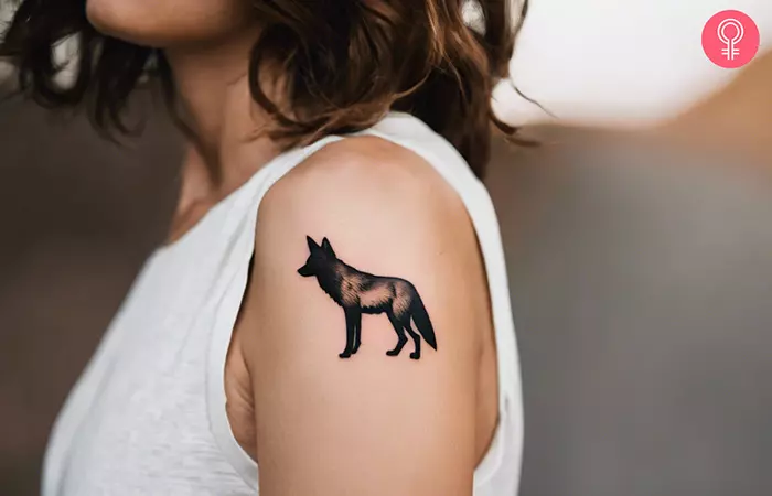 Coyote tattoo on a woman’s upper arm