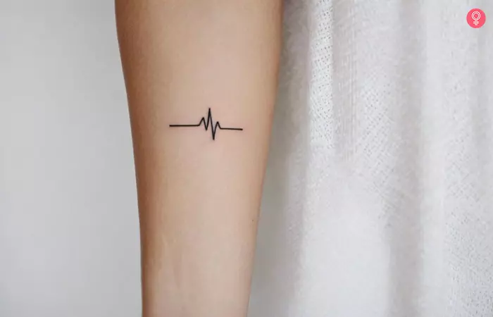 ECG heart rhythm medical tattoo on wrist