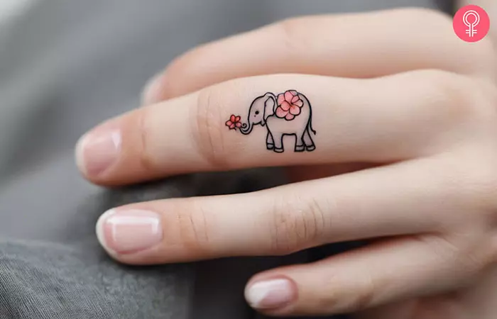 Cute baby elephant floral tattoo on the finger