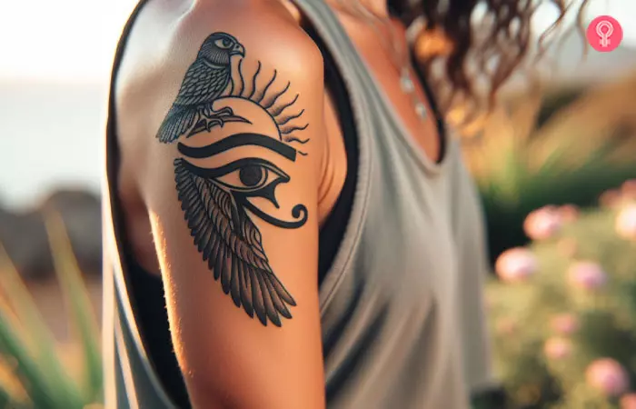 An eye of Horus and Falcon tattoo design on the upper arm.