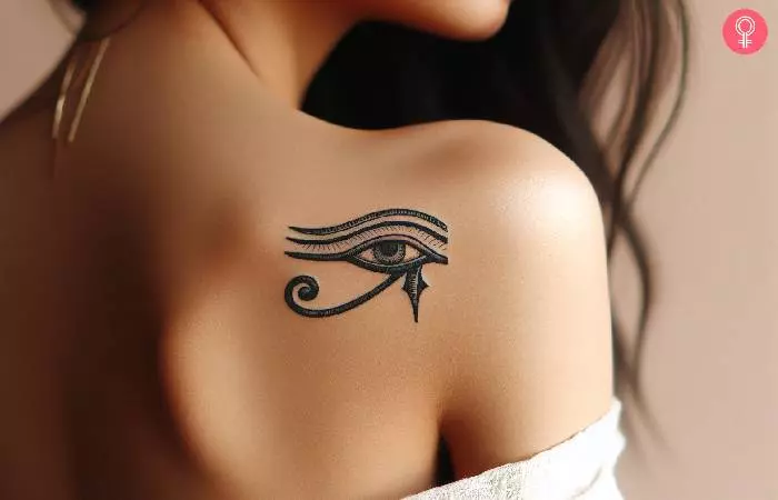 Eye-of-Horus or Eye-of-Anubis tattoo on a woman’s back