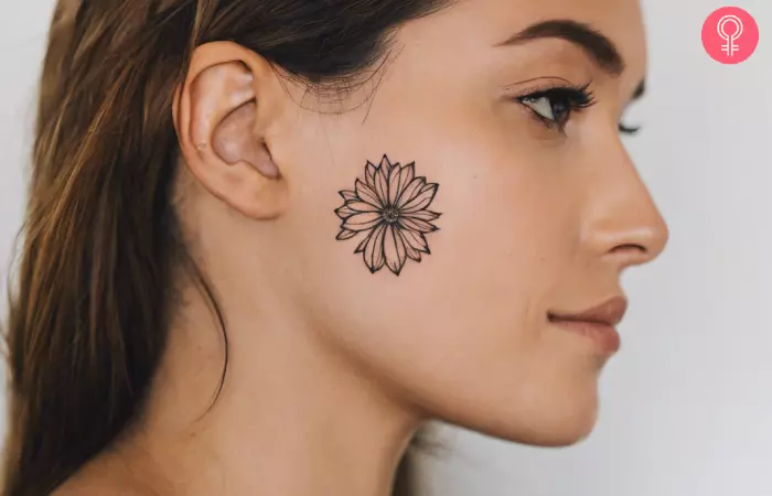 Female small side face tattoo