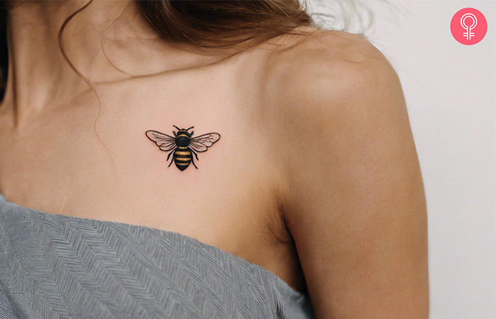 A black bumble bee tattoo with fine wings