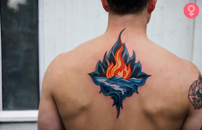 A fire and ice tattoo design on the back of a man