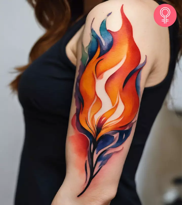Fire tattoo design on the arm of a woman