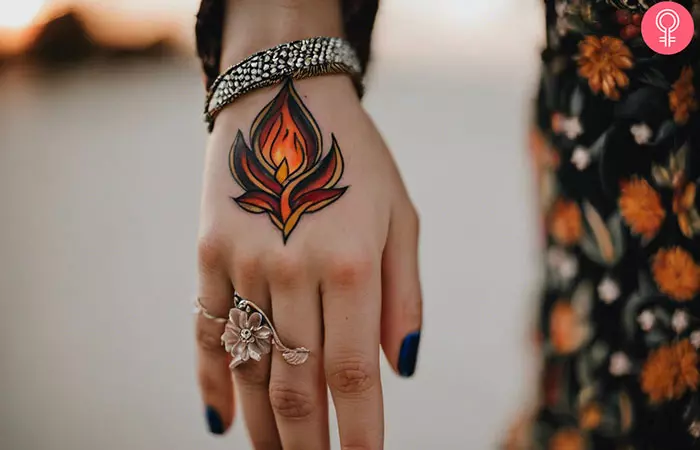 Woman with flame hand tattoo