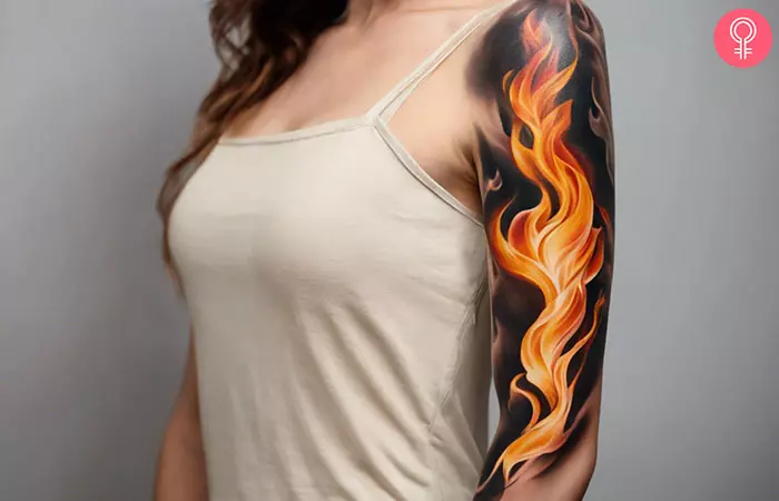 Woman with half-sleeve flame tattoo