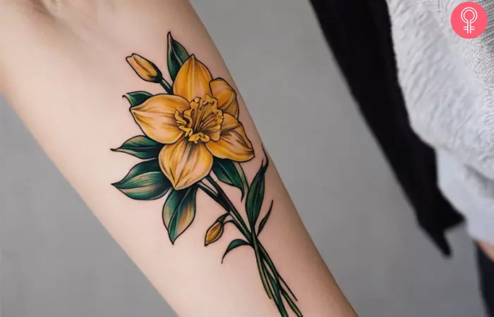 A daffodil tattoo on the forearm