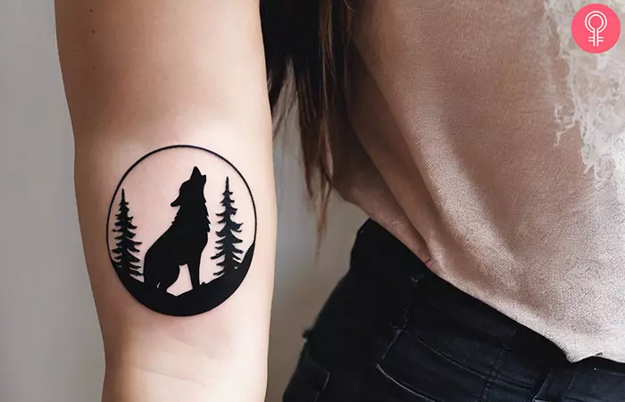 Forest wolf silhouette tattoo on the forearm