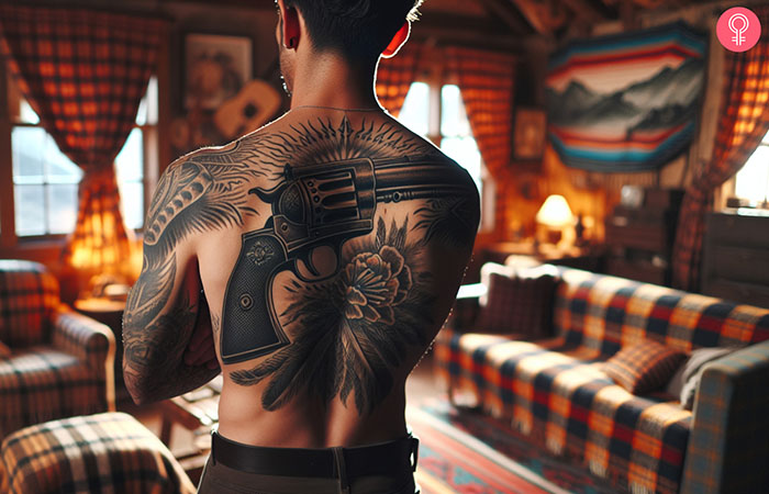 A gangster gun tattoo design on the back of a man