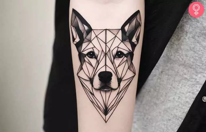 A man with a geometric blackwork dog tattoo design 