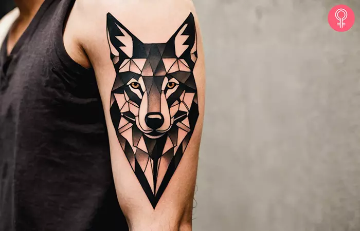 Geometric coyote tattoo on a man’s arm