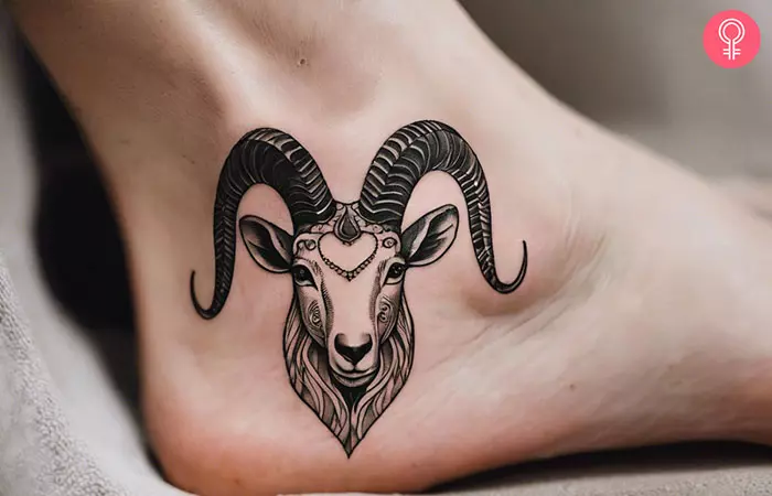 Woman with a girly Capricorn sign tattoo on her ankle
