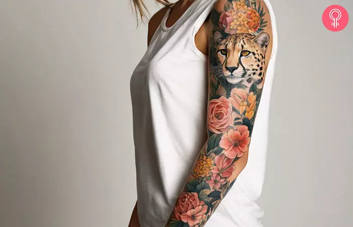 Girly cheetah print sleeve tattoo on a woman’s arm