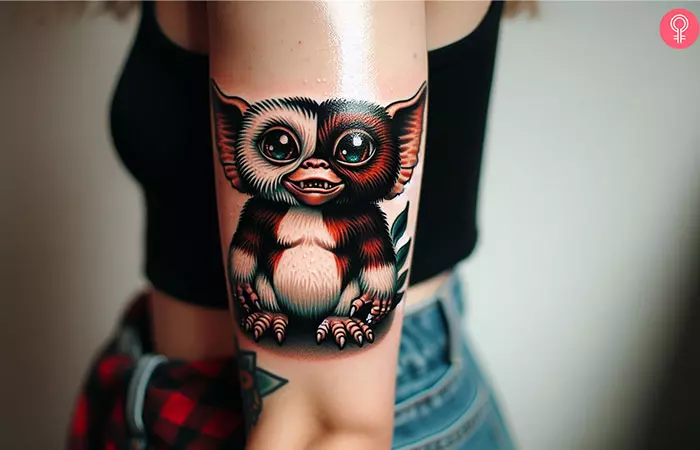 A gizmo gremlin tattoo on the arm