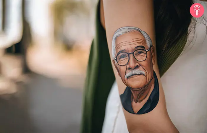 A grandpa portrait tattoo on the arm
