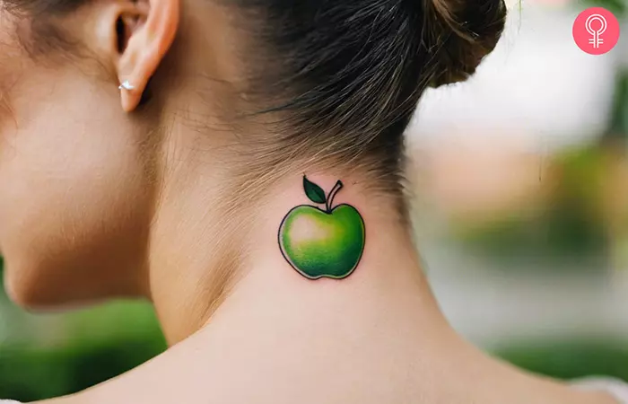 Green apple tattoo on the back of the neck