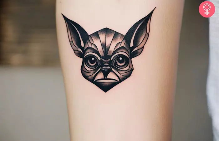 A woman with a gremlin flash tattoo