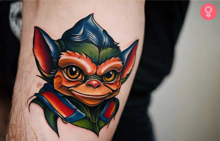 A gremlin tattoo on the arm