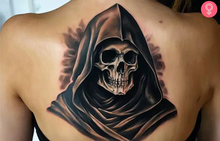 A Grim Reaper tattoo on a woman’s back