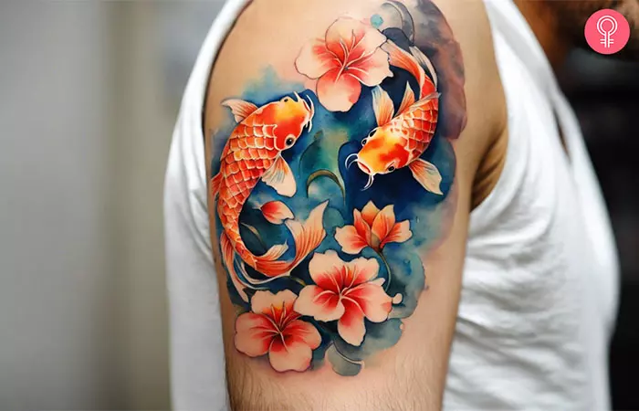 A growth tattoo of koi fishes in yin-yang formation on the upper arm