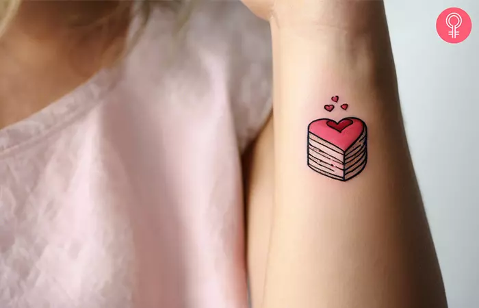 Heart cake tattoo on the side of the wrist