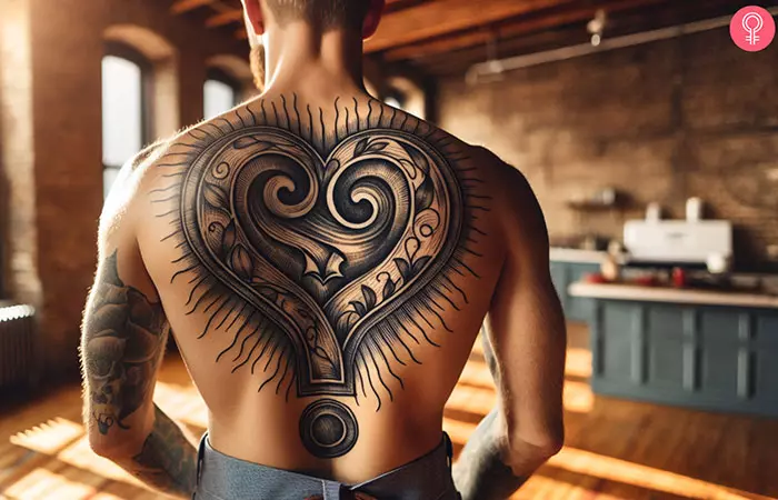 A heart-shaped double question mark tattoo on the back of a man