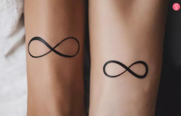 Couple with matching infinity wedding tattoos on their wrists