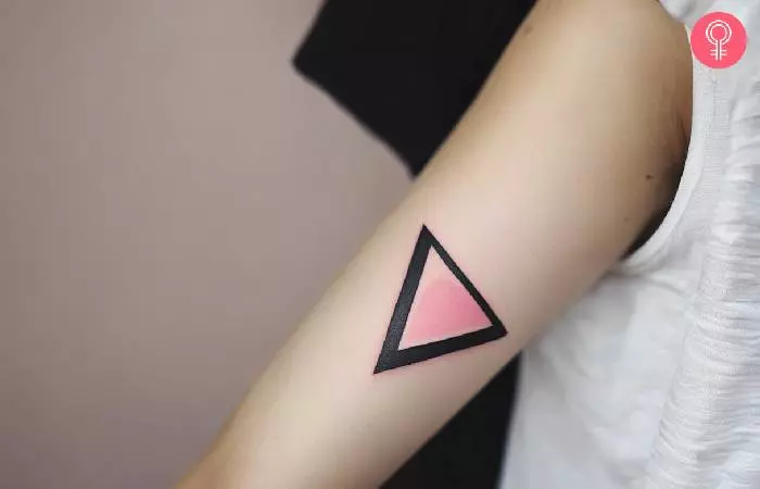 Inverted triangle tattoo on the upper arm