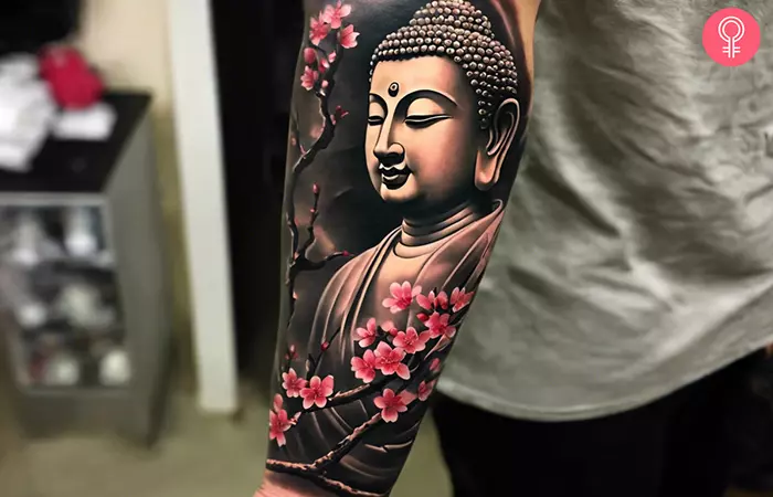 Japanese Buddha tattoo on the forearm of a man