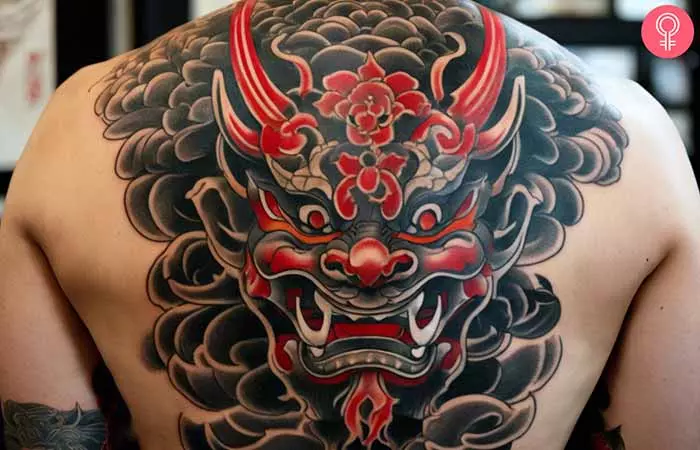  A man with a Japanese Oni mask tattoo on his back